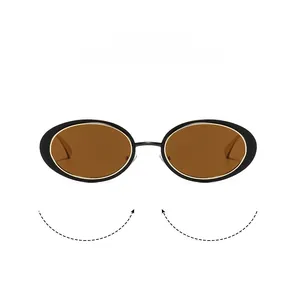 Detail showing flexible metal frame of oval vintage sunglasses with brown lenses