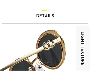 Detail of gold metal temples with diamond-encrusted double rings on sunglasses