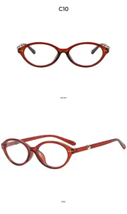 Detail view of red translucent cat-eye sunglasses frames with silver metal side accents