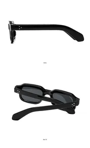 Detail view of black rectangular sunglasses featuring silver triple metal stud accents