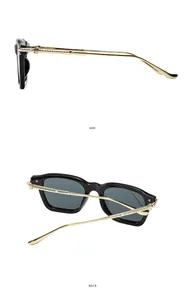 Détails de lunettes carrées avec branches en métal doré gravé et monture noire épaisse