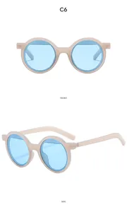 Détail de lunettes de soleil rondes beige mat avec verres bleus vues de face et de profil