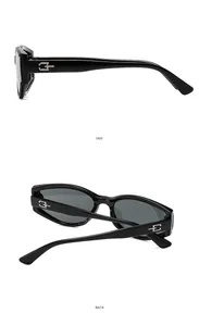 Detail of vintage cat eye sunglasses with thick temples and silver logo accents