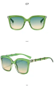 Green translucent sunglasses with bamboo textured legs and gradient lenses in front side view