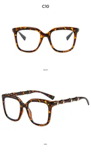Detail of tortoise shell cat-eye sunglasses with bamboo-style gold metal temple accents