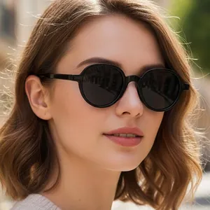 Elegant black round frame sunglasses for women with dark UV lenses for outdoor travel
