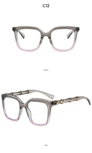 Detail of oversized retro sunglasses with gradient frames and bamboo-style gold metal temples