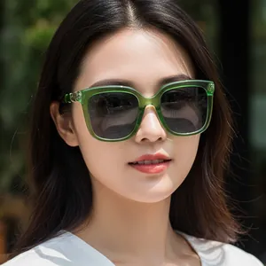 Retro oversized square sunglasses with bamboo-style temples and green transparent frames