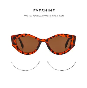Detail of vintage Y2K cat-eye sunglasses with tortoiseshell frame and brown lenses