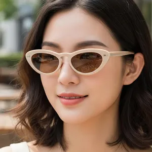 Vintage oval cat-eye sunglasses with cream frames and brown lenses for stylish women