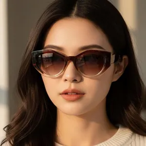 Women's Y2K cat-eye sunglasses with gradient brown frames and lenses in natural lighting