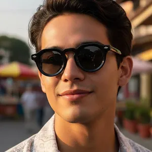 Lunettes de soleil rétro noires rondes avec rivets pour un look urbain et élégant