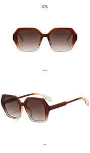 Vues de face et de côté de lunettes de soleil oversize polygone avec verres dégradés marron