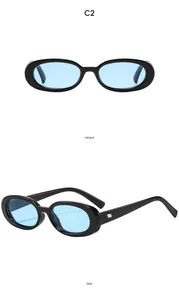 Detail view of oval retro sunglasses with black frames and light blue lenses in C2 style