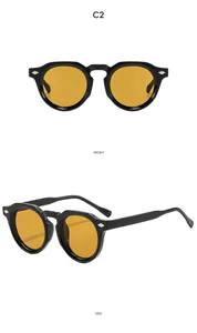 Vues de face et de côté de lunettes de soleil rondes rétro à verres jaunes et rivets