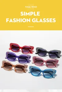 Detail of kids cat-eye sunglasses with glitter wing frames and gradient lenses in six colors