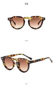 Vues de face et de côté de lunettes de soleil rondes vintage avec rivets en métal chic