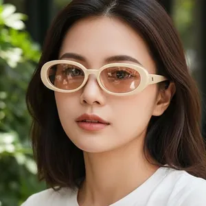 Vintage oval sunglasses with off-white frames and light brown lenses for outdoor women