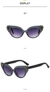 Cat eye kids sunglasses in C1 grey frame with purple gradient lenses and glitter accents