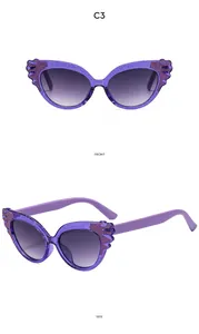 Front and side view of purple cat eye kids sunglasses with glitter and wing details