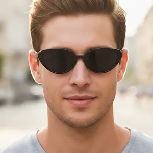 Y2K retro oval cat-eye sunglasses with black frames worn in an urban outdoor setting