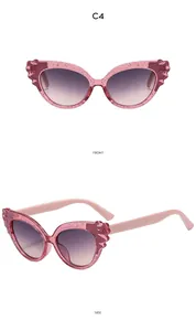 Detailed front and side view of cat-eye kids sunglasses with pink glitter frames