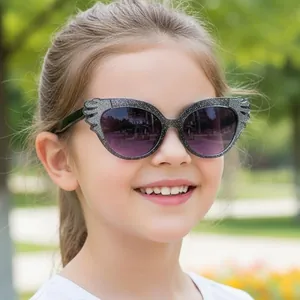 Glittery silver wing-shaped kids sunglasses with purple gradient lenses for girls