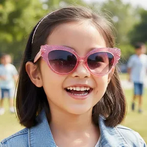 Cute pink glitter butterfly wing sunglasses for kids with gradient lenses on child model