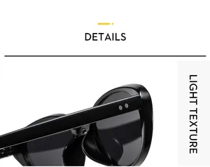 Close-up detail of glossy black cat-eye sunglasses frame with light texture and metal rivets