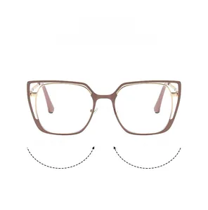 Detail of retro cat-eye frames featuring brown acetate and gold metal temple accents