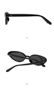 Detail view of the sleek black oval cat-eye sunglasses from side and back angles