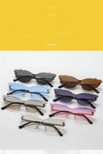 Detailed view showing seven color variations of rimless cloud-shaped fashion sunglasses