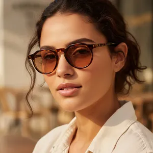 Vintage oval tortoiseshell sunglasses with brown gradient lenses for outdoor fashion