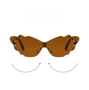 Detail of rimless butterfly sunglasses with scalloped lens edges and gold accents