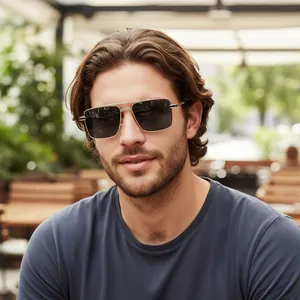 Close-up of double-bridge square metal sunglasses with textured temples on a male model