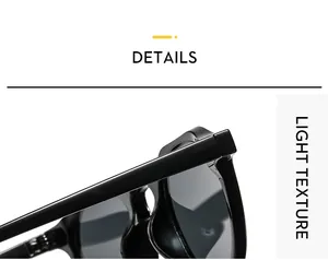 Detailed close-up of high-gloss black oval sunglasses frame showing the light texture hinge