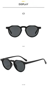 Front and 45-degree side views of black vintage oval sunglasses with curved frame design