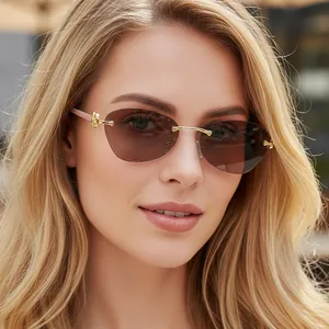 Luxury rimless sunglasses with brown gradient lenses and golden leopard head decor