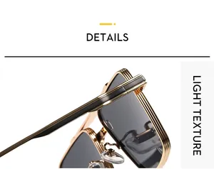 Close-up of golden metal frame sunglasses with fine linear texture and black enamel accents