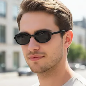 Chic black oval sunglasses with dark grey lenses for outdoor fashion and driving