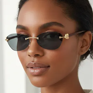 Chic rimless sunglasses with gold flower hardware and wood grain temples on a model