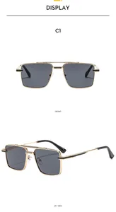 Close-up of square metal aviator sunglasses with gold frames and double bridge detail