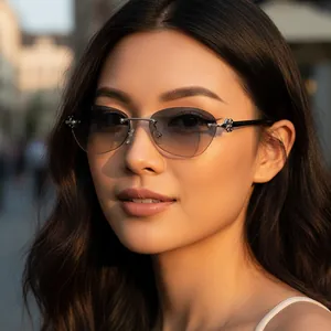 Vintage rimless gradient sunglasses with silver floral metal accents worn by a model