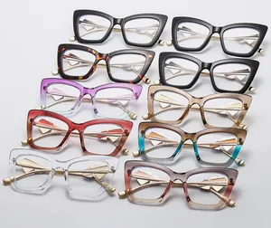 Collection of cat-eye frames with golden metal temples and heart-shaped accents