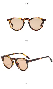Front and side views of vintage oval tortoise shell sunglasses with light brown lenses