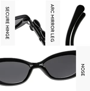 Détail des charnières métalliques et branches arquées des lunettes œil de chat noires