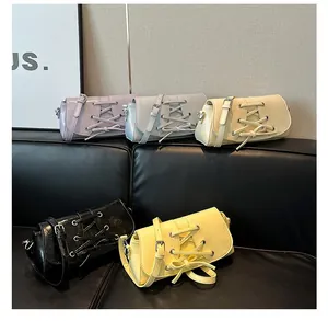 Detailed view of colorful macaron lace-up crossbody bags in five stylish summer colors