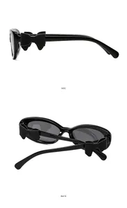 Vue détaillée latérale et arrière des lunettes œil de chat avec nœud 3D noir