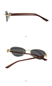 Detail view of rimless grey sunglasses with golden petal hinge and wood-textured temples