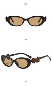 Gros plan de lunettes œil-de-chat avec nœud sur la branche en vues de face et de profil